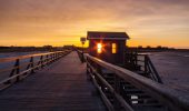 Sonnenuntergang an der Seebrücke st peter ording